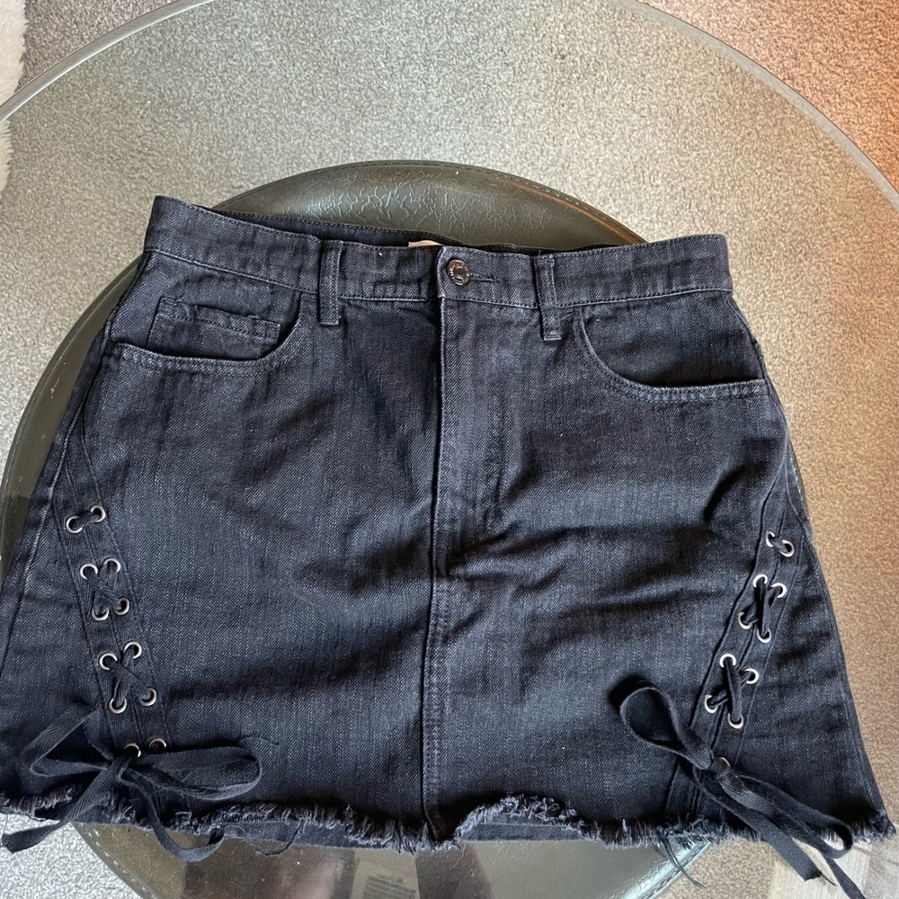 Black denim skirt with design on legs!